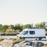 white van on gray concrete road during daytime